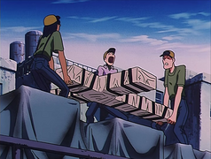 Three men struggle to lift the heavy Punisher.